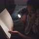 Girl Reading Book to Brother at Night - VideoHive Item for Sale