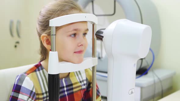 Ophthalmological Examination of the Girl on the Corneo Topographer alt