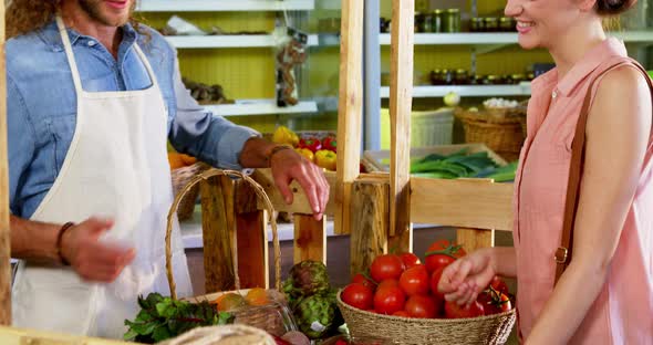Customer purchasing vegetables in organic section alt