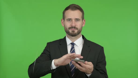 Happy Businessman Throwing Out Money Against Chroma Key alt
