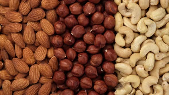 Different types of nuts. Assorted nuts cashews, almonds, hazelnuts top view. alt