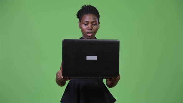 Young Beautiful African Businesswoman Using Laptop