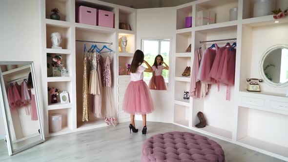 Teen Girl in Tutuskirt and Highheeled Shoes Making Selfie on Smartphone alt