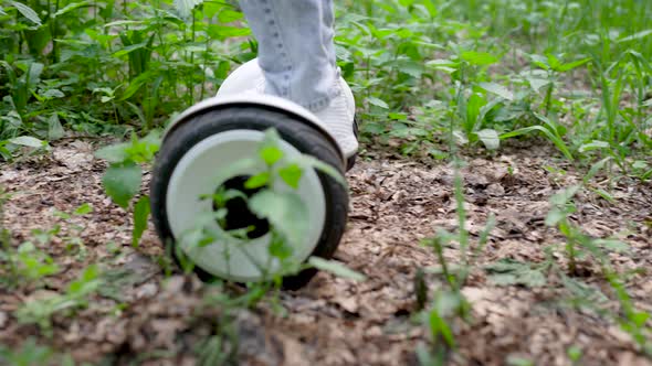 A Girl in Jeans and a Hoodie Rides on a Gyrocopter. The Electric Transport of the Future Is Suitable alt