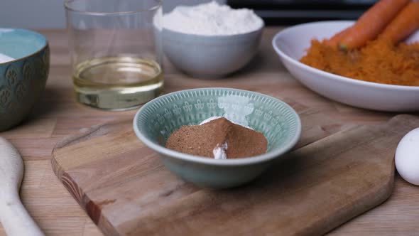 Ground Cinnamon And Baking Soda In A Bowl. Carrot Cake Baking Preparation. close up alt