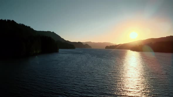 Bird'seye View of the Sunrise Over the River with Hilly Terrain alt