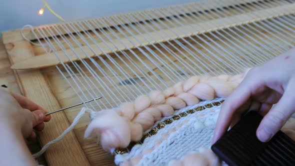 Woman's Hands Running on a Loom