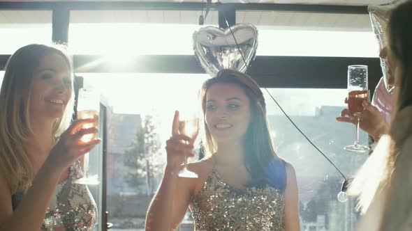 Gorgeous Girls Dancing and Drinking Champagne alt