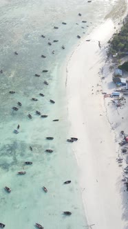 Boat Boats in the Ocean Near the Coast of Zanzibar Tanzania Slow Motion Vertical Video alt