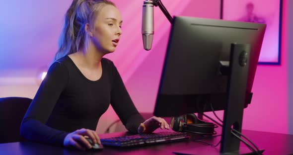Close-up Up of Esport Gamer Girl Streaming and Plays Online Video Game on PC