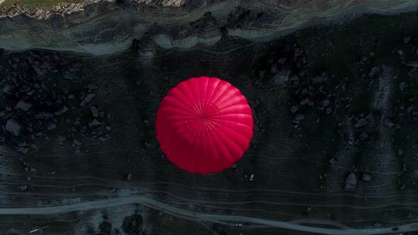 Hot air balloon over the cliffs alt