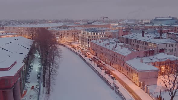Aerial View of Embankment of Frozen River Griboedov Canal in a Snowy Winter Evening Night alt