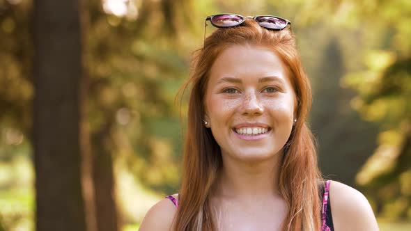 Portrait of Redhead Teenage Girl in Summer Park alt