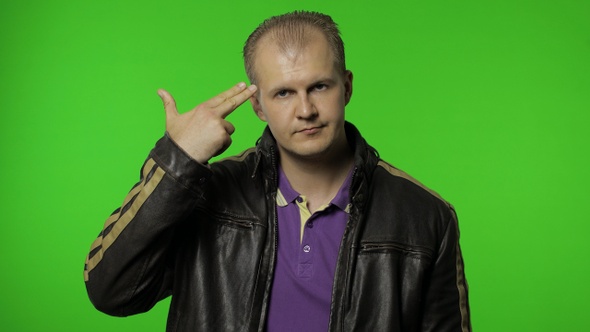 Man Pointing Finger Pistol To Head, Showing Suicide Gesture, Shooting Himself with Hand Gun alt