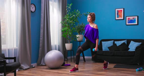 Profile View of Sporty Girl Doing Lunges Workingout Leg Muscles and Glutes in Loft Interior alt