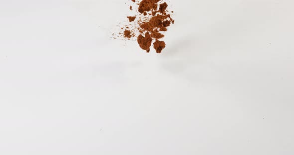 Star Anise illicium verum,, powder falling against White Background, Slow Motion 4K alt