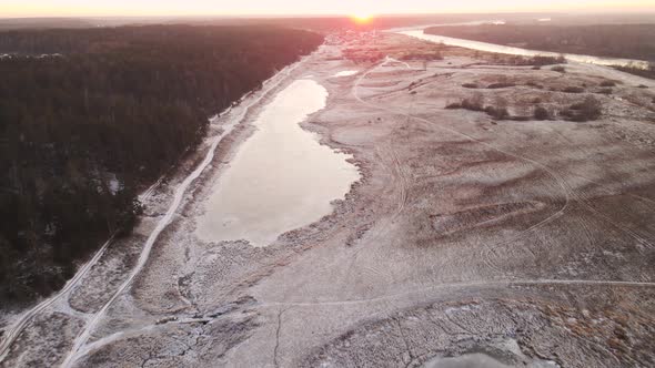 Field Forest and Lake Under the Snow in the Beautiful Light of the Sun alt