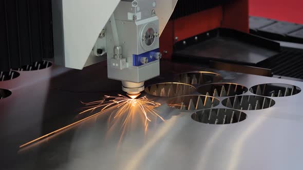 Laser Cutting Machine Working with Sheet Metal with Sparks