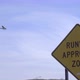 Plane Lands Near an Airport Approach Warning Sign - VideoHive Item for Sale