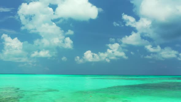 Aerial drone shot tourism of paradise coastline beach lifestyle by blue lagoon and bright sandy back alt