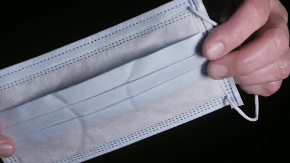 A Closer Look of the White Part of the Surgical Mask alt