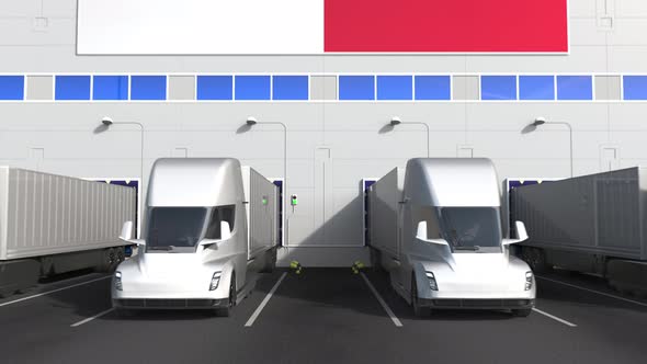 Trailer Trucks at Warehouse Loading Dock with Flag of MALTA alt