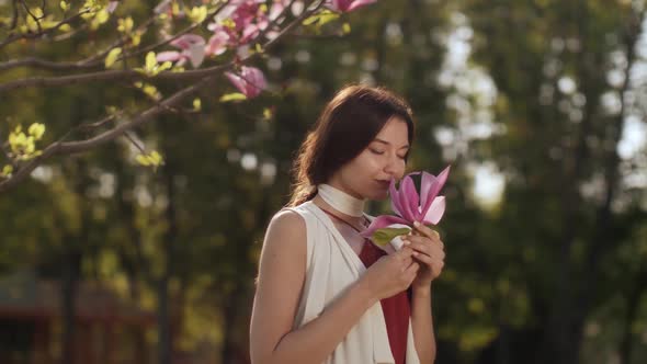 Spring Beauty Portrait of a Woman with Flower Outdoors alt