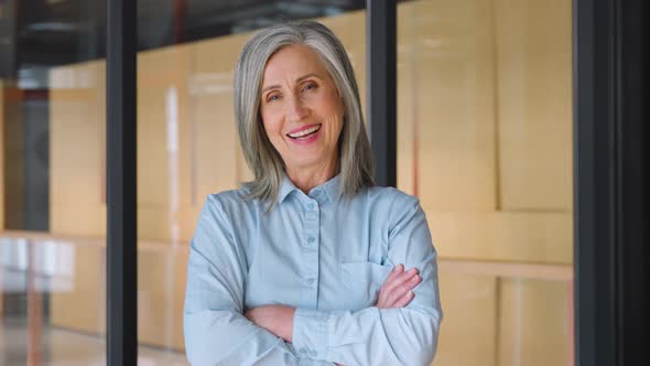 Portrait of Smiling Confident 60s Grayhaired Mature Woman alt