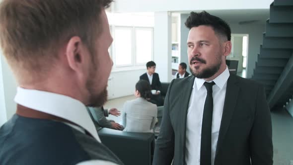 Two Men Discussing Business Issues alt