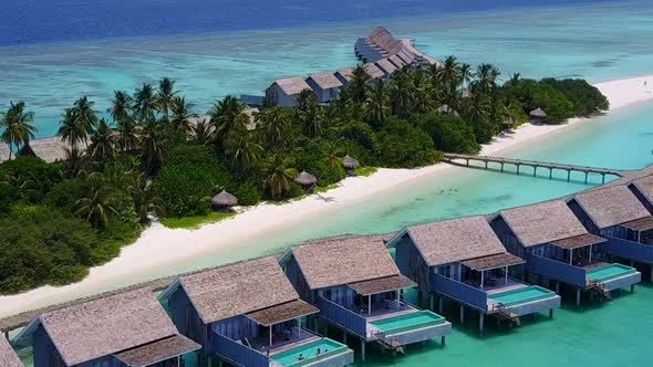 Drone view texture of coast beach trip by blue ocean with sand background alt