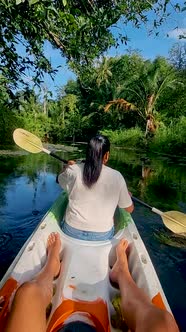 Couple in Kayak in the Jungle of Krabi Thailand Men and Woman in Kayak at a Tropical Jungle in Krabi alt