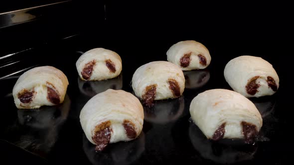 Timelapse  Seven Mini Homemade Buns with Chocolate Filling in Electric Oven