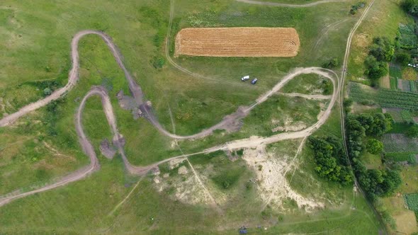 Aerial Top Down View of Motocross Track Showing the High-performance Off-road Motorcycles