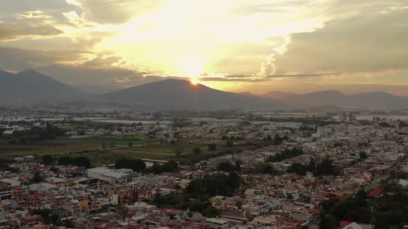AERIAL: Zamora, Michoacan, Mexico, Mountains, Sunset (Flying Forward) alt