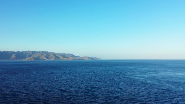 Aerial drone travel of tranquil sea view beach vacation by blue sea and white sandy background of jo alt