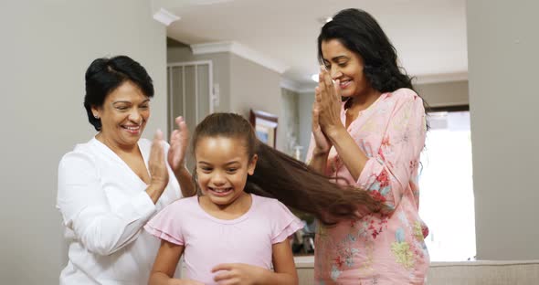 Multi-generation family having fun in living room 4k alt
