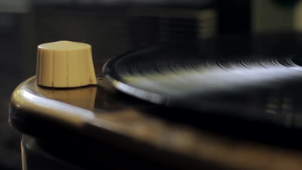 Vintage Phonograph Player with a Vinyl Record. alt