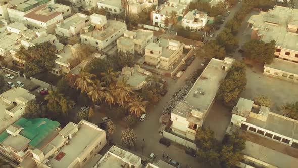 Aerial View Over Residential Road With Traffic In Karachi, Pakistan. Follow Shot alt