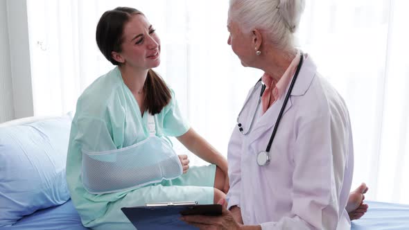 Senior Female doctor explaining the woman patient's results from sick symptoms alt