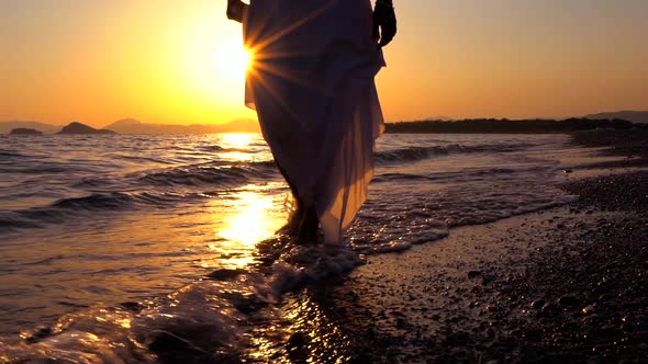 Feet Walking At Seashore Sunset alt