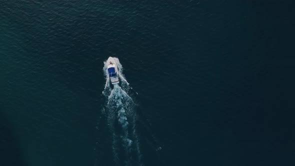 Deep sea fishing boat trip at sunrise in the Indian Ocean at Watamu, Malindi, Kenya. Top down aerial alt