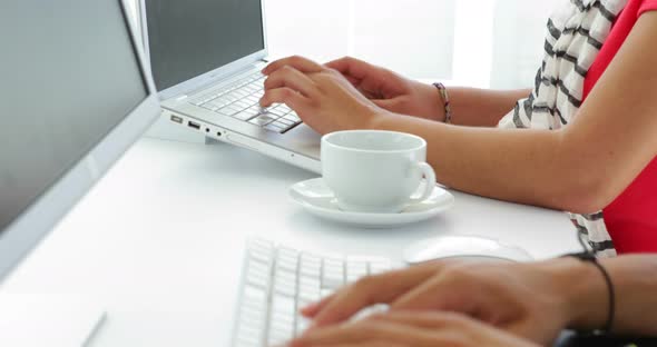 close up of young female creative designer working on computer alt