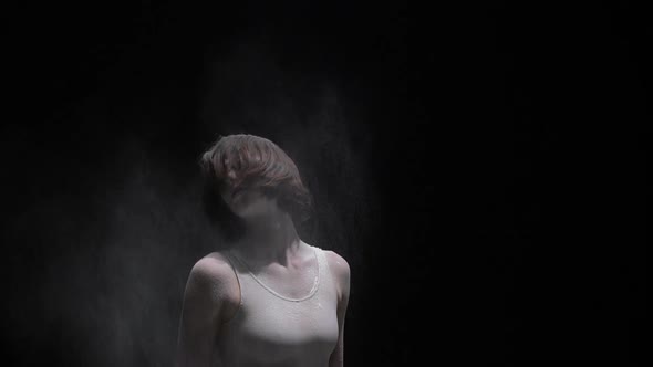 Beautiful Girl Throwing Dust View in the Dark