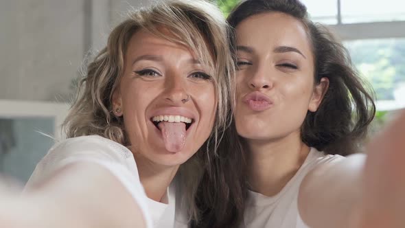 Two women taking selfie.