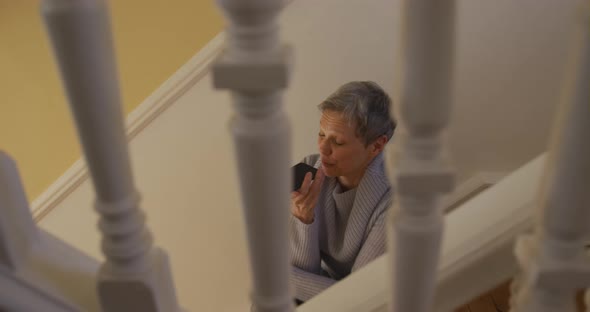 Senior woman at home alone alt