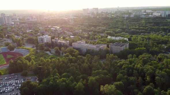 Green city park aerial near residential buildings