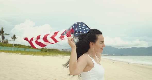 Patriotism Independence Day and Holidays Concept Happy Smiling Young Woman in Swimsuit with National alt