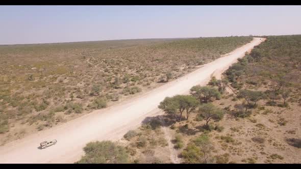 Safari Vehicle Kicking Dust