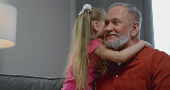 Happy Affectionate Family Adult Single Parent Dad and Small Cute Kid Daughter Cuddling Looking at alt