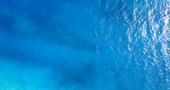 Tropical overhead island view of a white paradise beach and aqua blue water background in colourful  alt